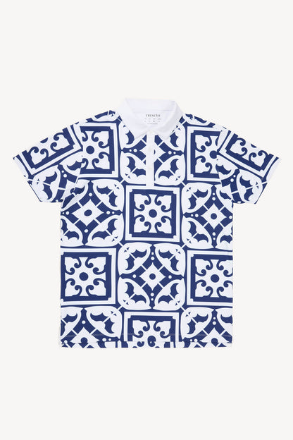White performance polo golf shirt with blue geometric pattern resembling tiles found on the Iberian peninsula on a white background
