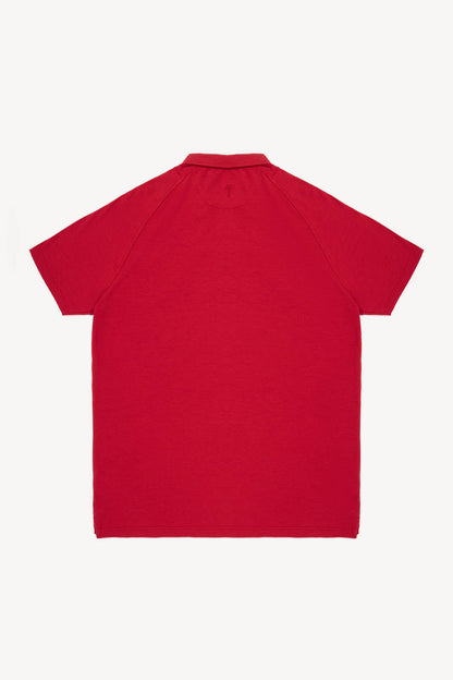 Red polo shirt on a white background