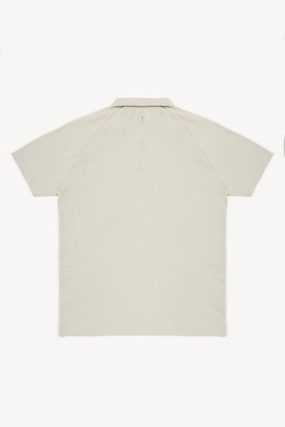 Beige short-sleeve cotton polo on a white background
