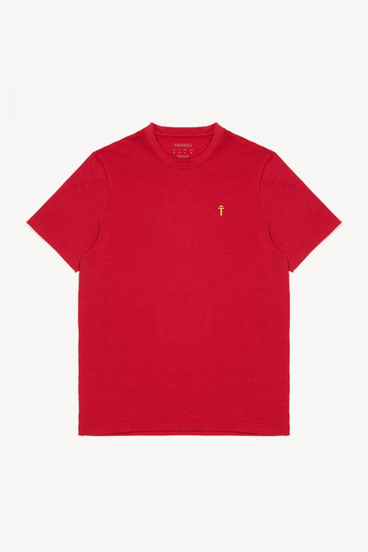 Red t-shirt with a small yellow Treseño logo on a white background