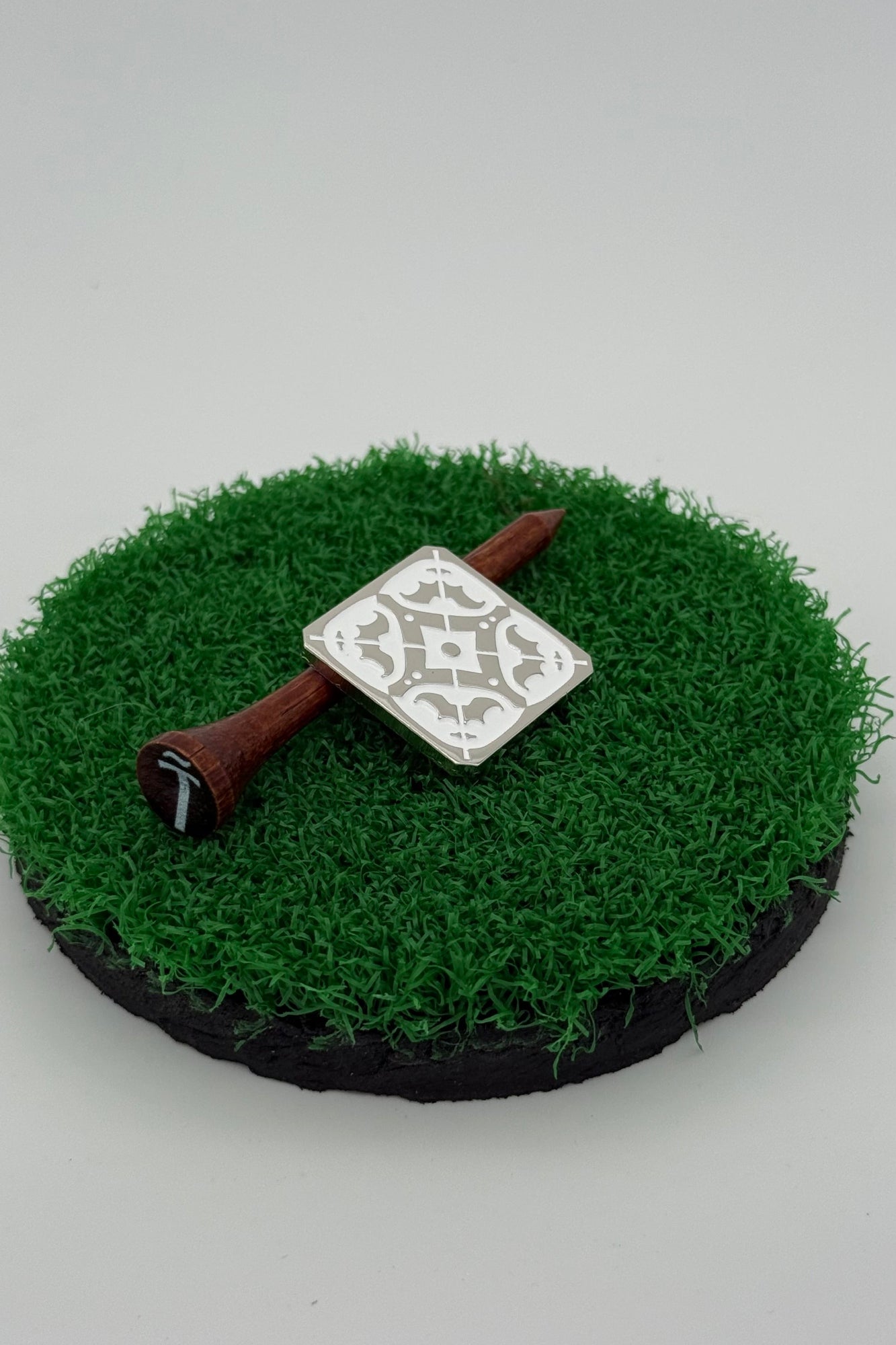 silver golf ball mark with Iberian tile (azulejo) engraving