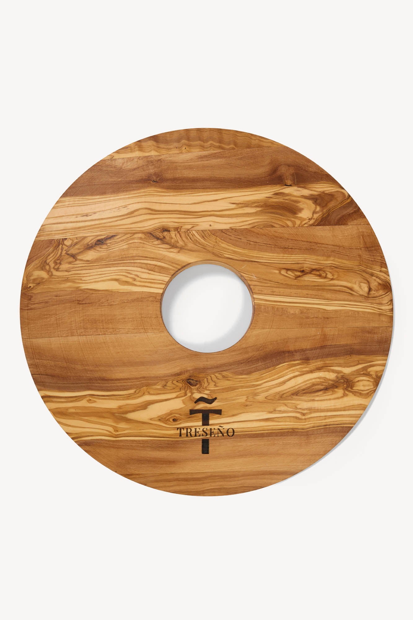 Handcrafted Olive wood putting aid with a central hole on a white background