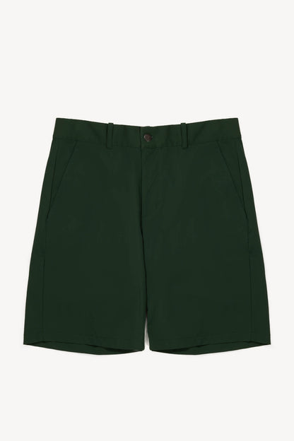 Dark green performance shorts on a white background