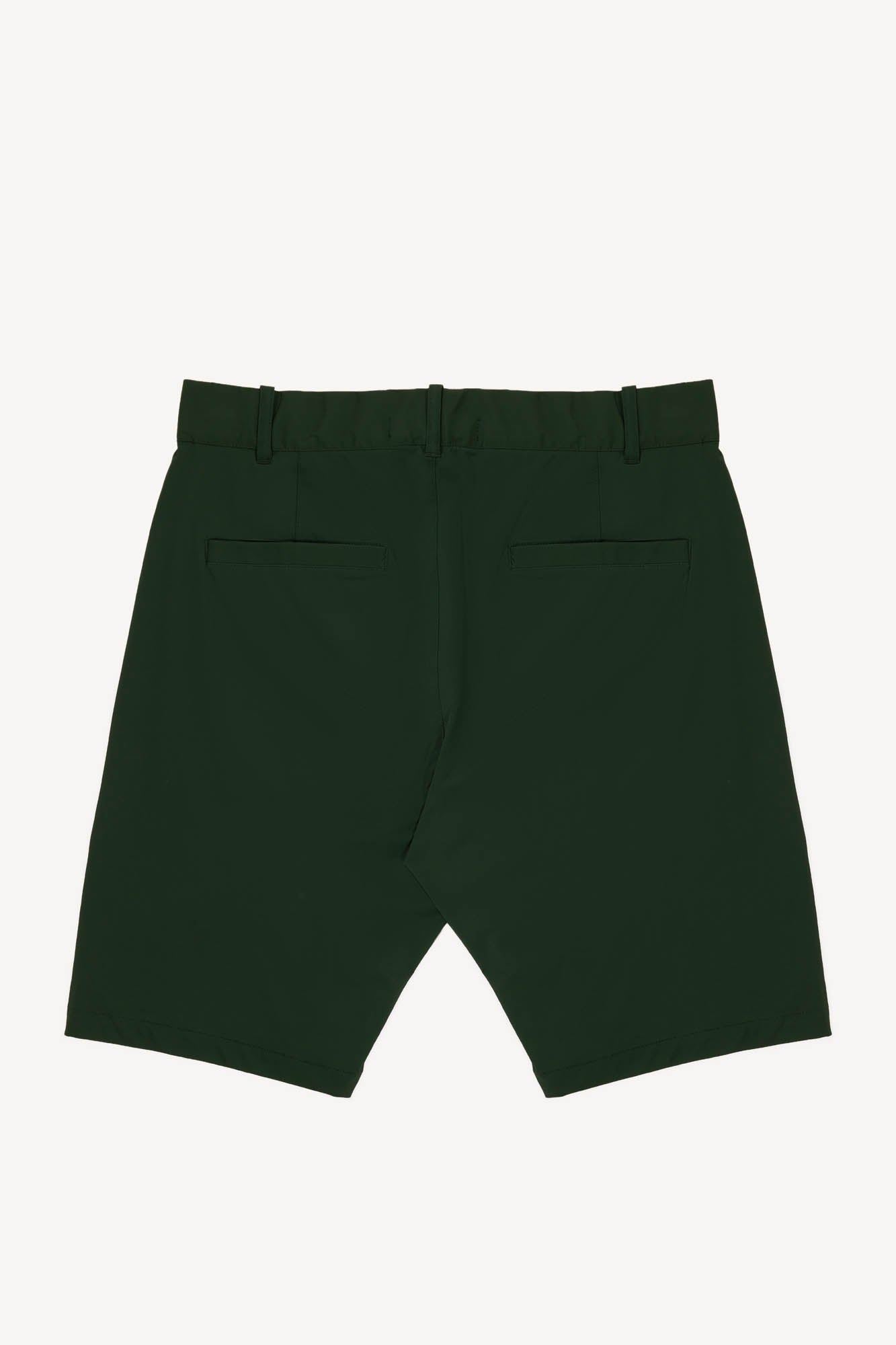Dark green performance golf shorts on a white background