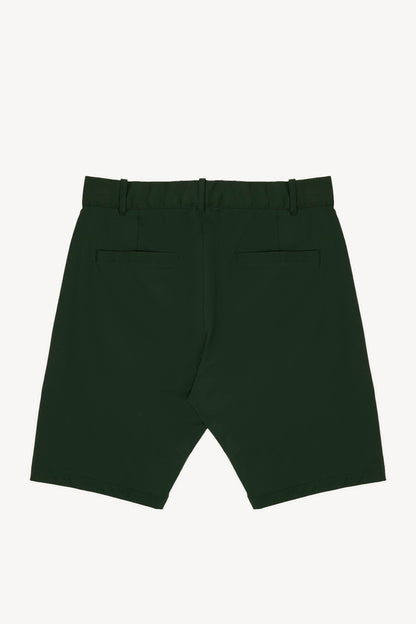 Dark green performance golf shorts on a white background