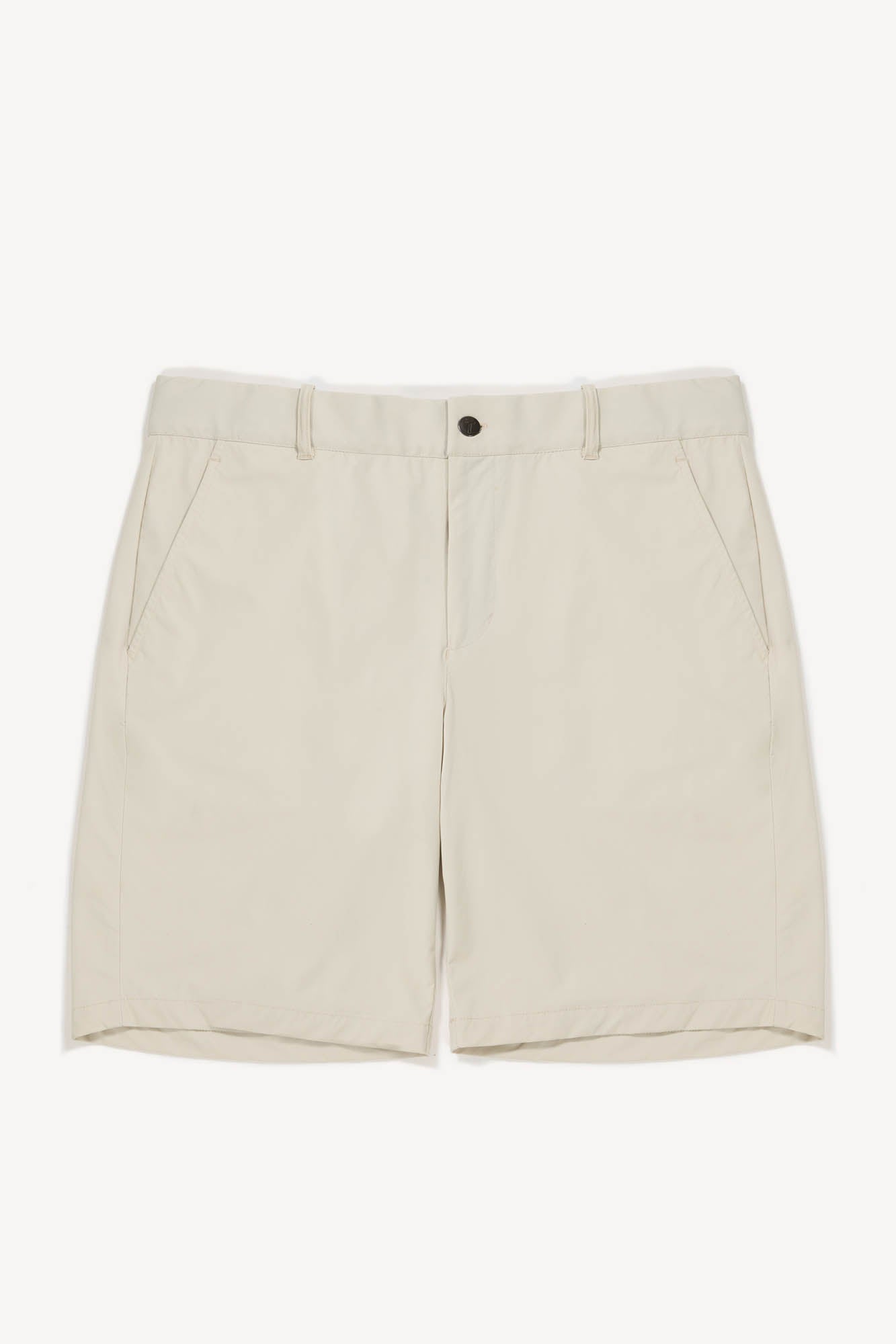 Beige golf shorts on a white background