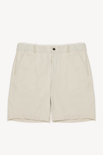 Beige golf shorts on a white background