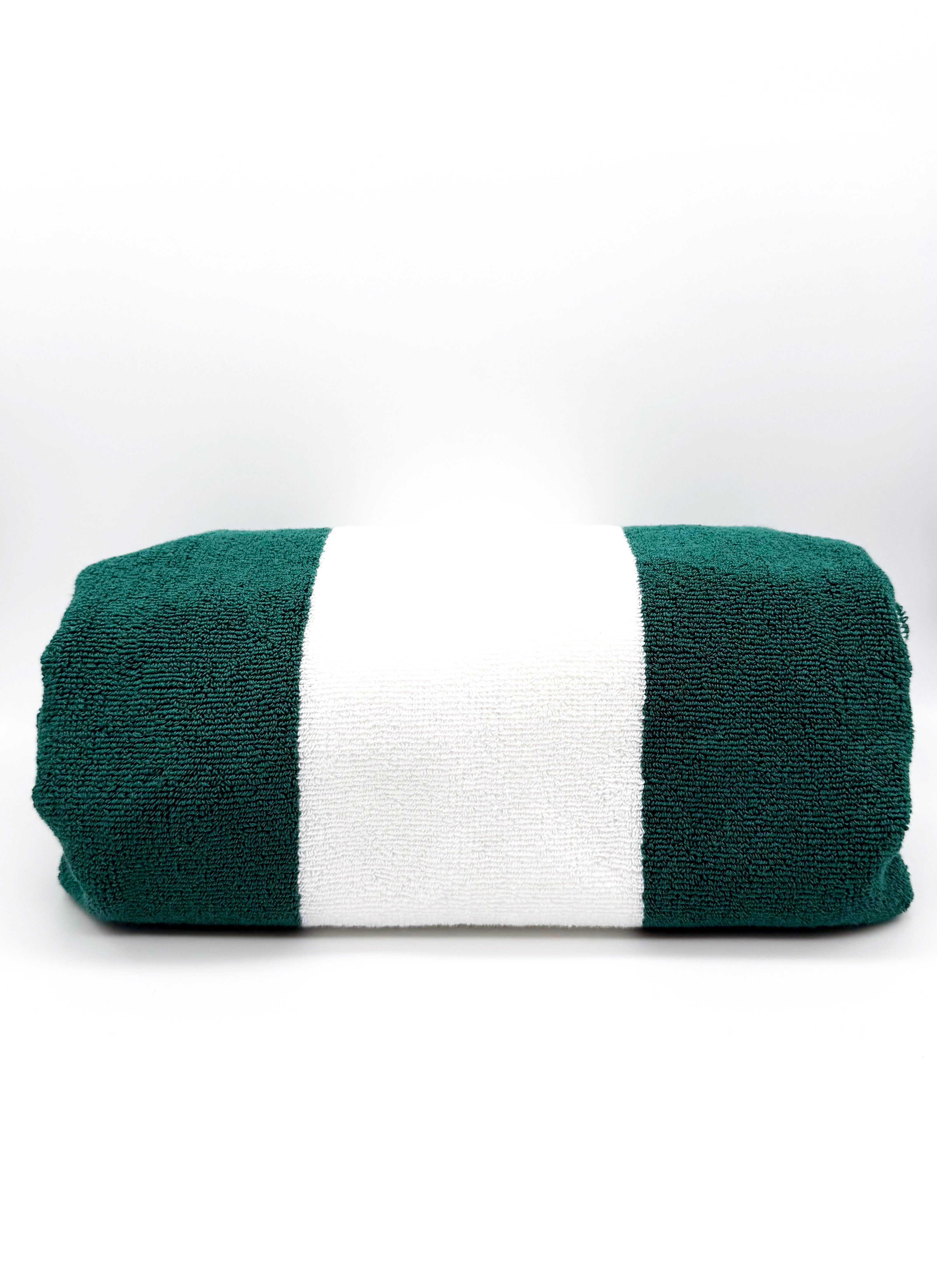 Green and white striped players towel on a white background