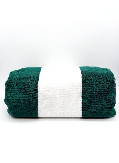Green and white striped players towel on a white background