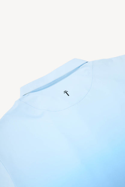 Light blue polo shirt with a small black Treseño logo on a white background