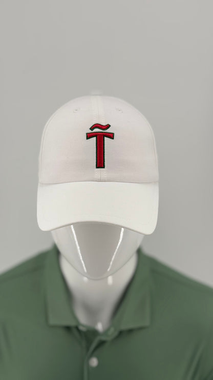 A white baseball cap with a red embroidered stylized 'T' logo on the front, displayed on a white mannequin head wearing a green polo shirt against a light gray background.